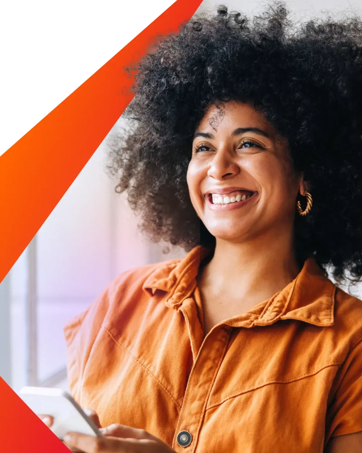 Smiling woman holding a smartphone within Awin's orange frame