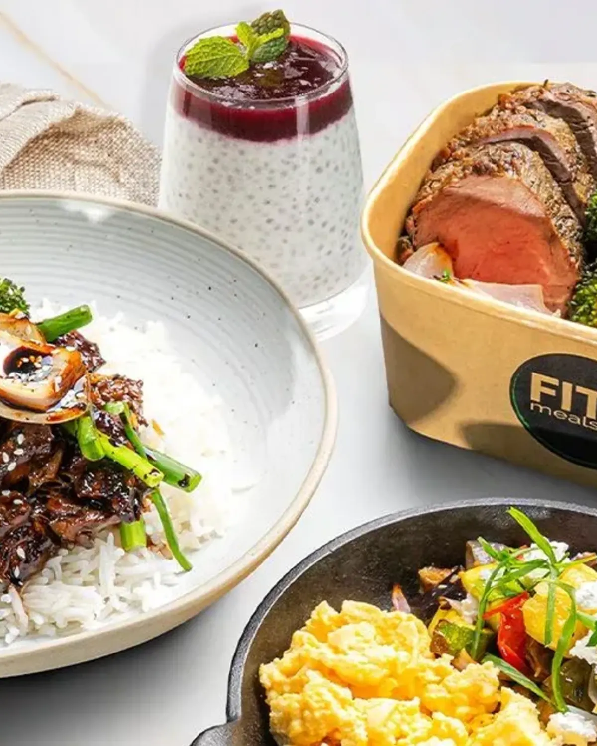 FITT Meals dishes with rice, steak and chia pudding