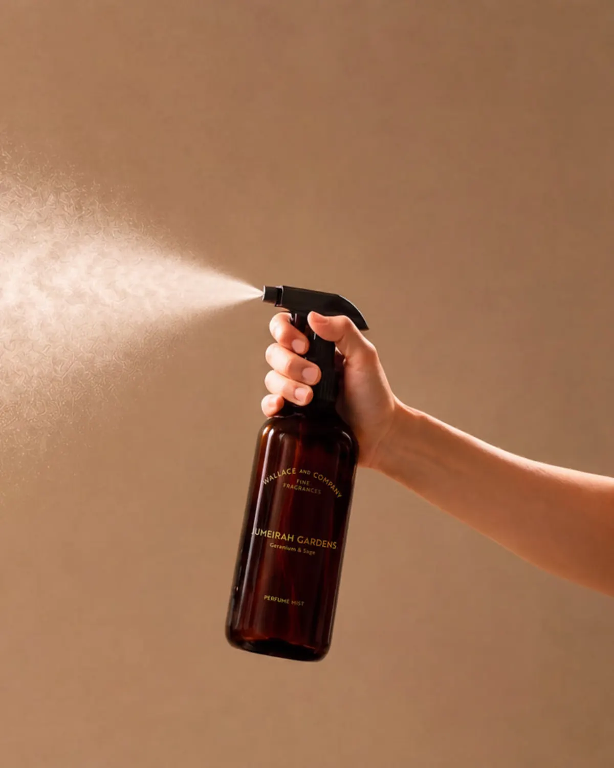Hand spraying Wallace and Company Jumeirah Gardens perfume mist